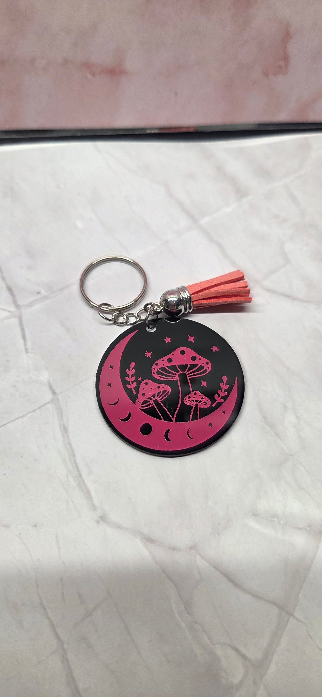 Pink mushroom on black arcylic keychain