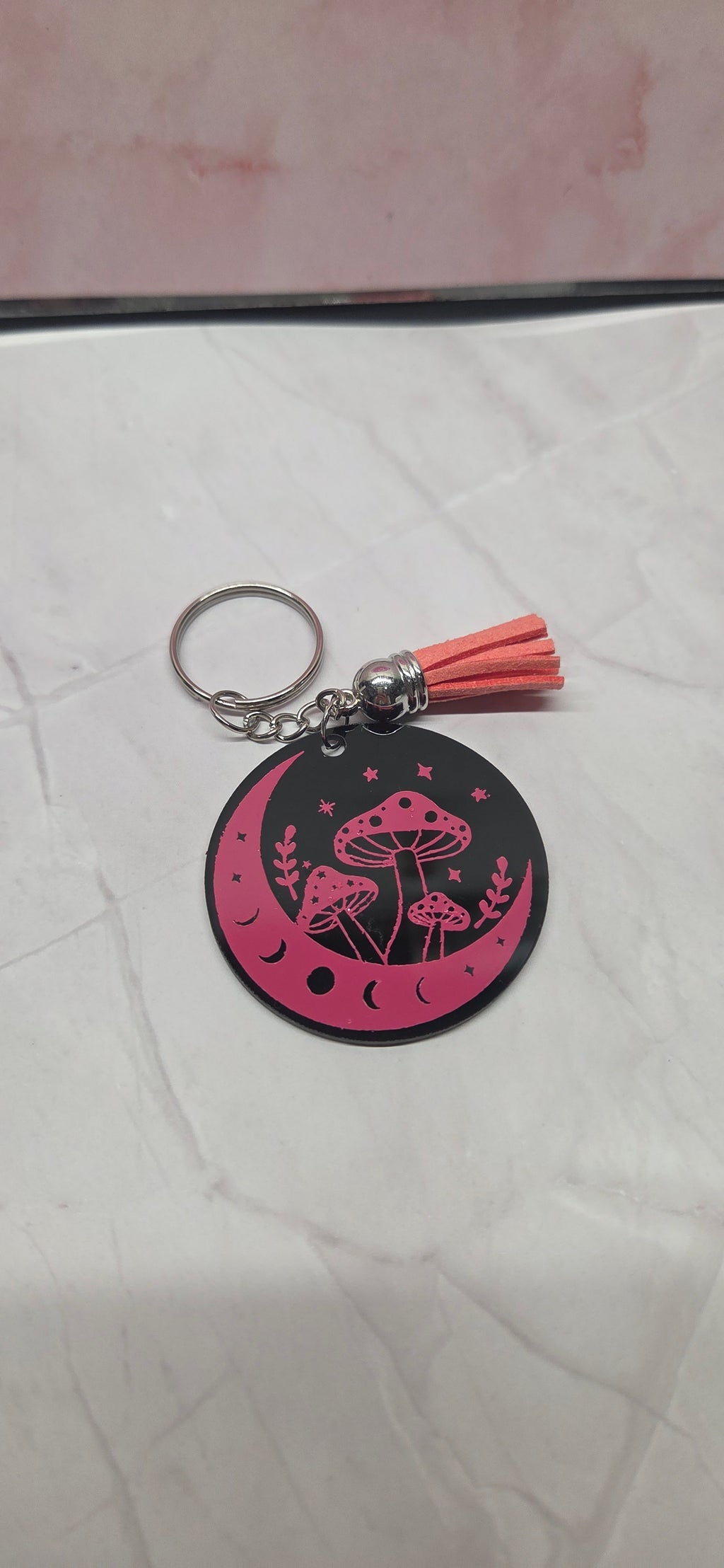 Pink mushroom on black arcylic keychain