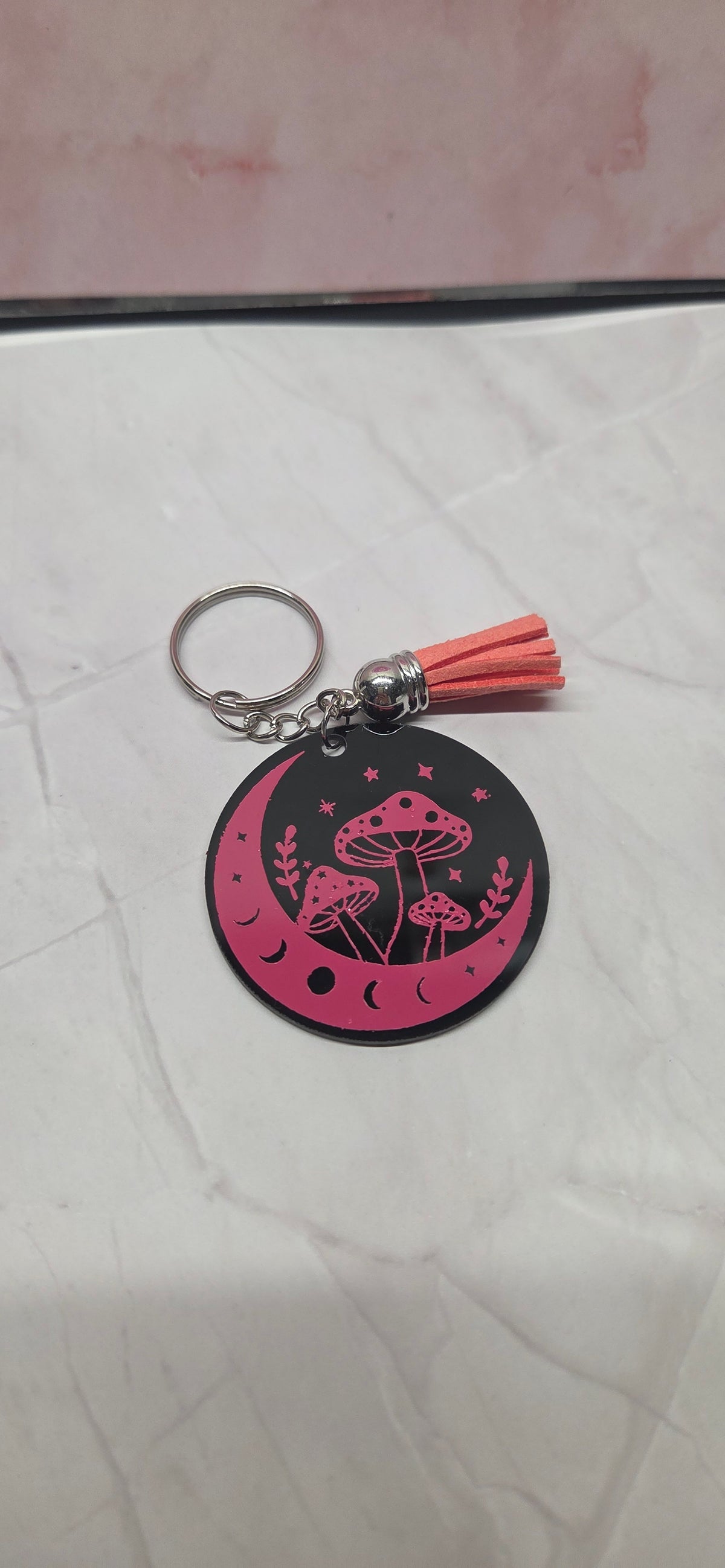 Pink mushroom on black arcylic keychain